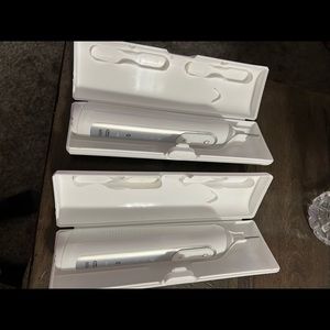 Oral B tooth brushes with travel case and charger.
